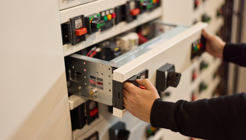 Electrical engineer working on circuit breaker panel